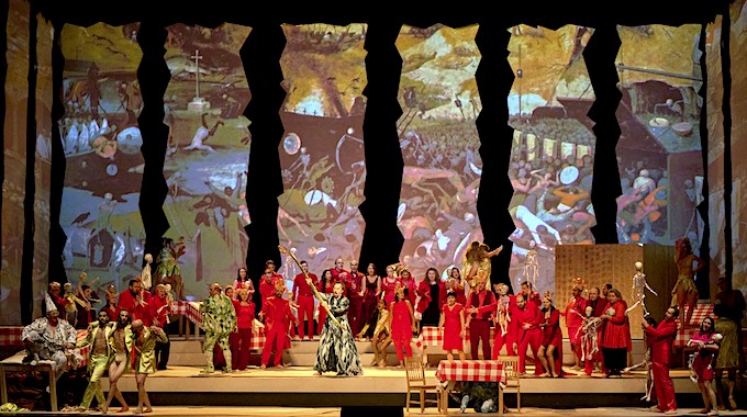 » Le Grand Macabre «, 3. Bild: Im Palast des babyhaften, verfressenen Fürst Go-Go (Andrew Watts mit dem Ensemble) © Wiener Staatsoper GmbH/Michael Pöhn